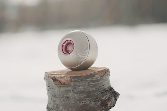 Luna Eye speaker on a wooden stump